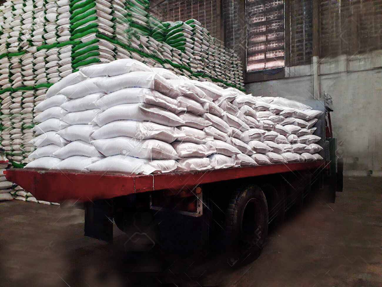 136442215-chemical-fertilizer-sacks-filled-with-white-sacks-stacked-on-top-of-a-ten-wheel-truck-to-store-in-th.jpg